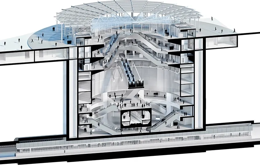 Un espace de 30 m évidé à l’intérieur du cylindre, entouré de galeries en balcons, accueille de grands escalators.